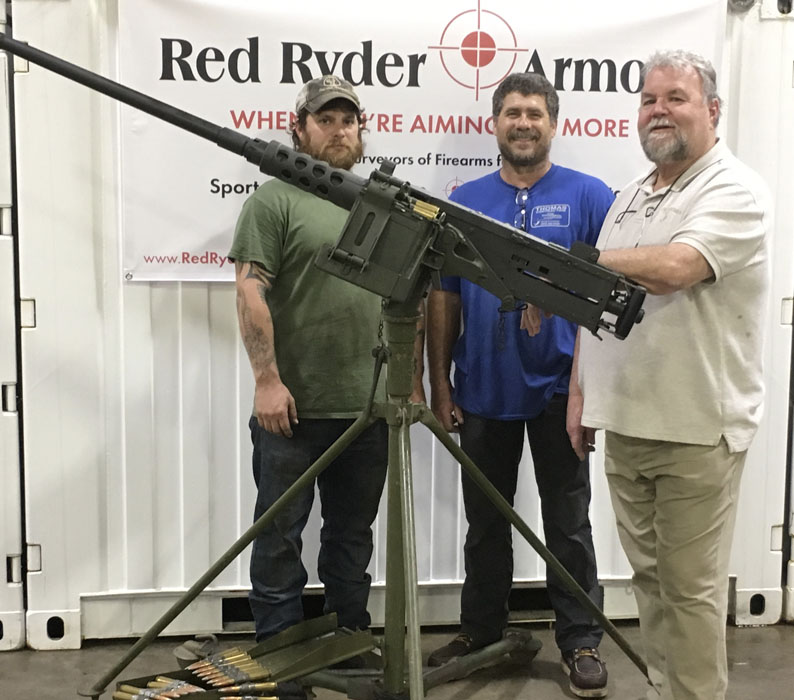 Customers posing with Browning M2 50cal Belt Fed Machine Gun (BMG) also known as a “Ma Deuce”